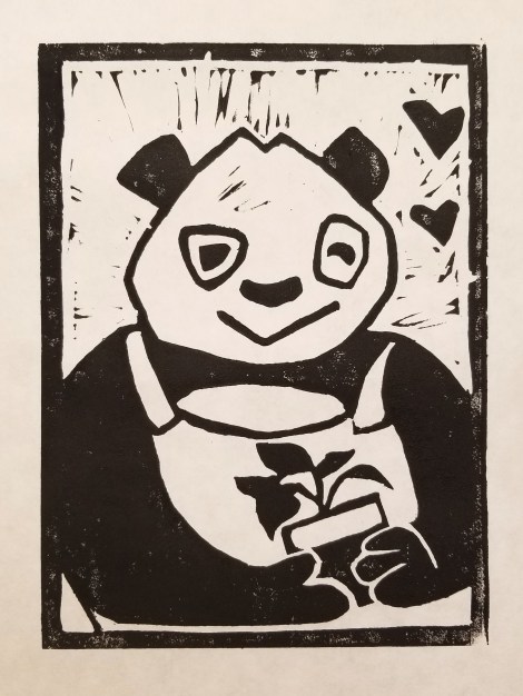 linocut of a panda wearing overalls and holding a potted plant with two small hearts in the background; black ink on white paper